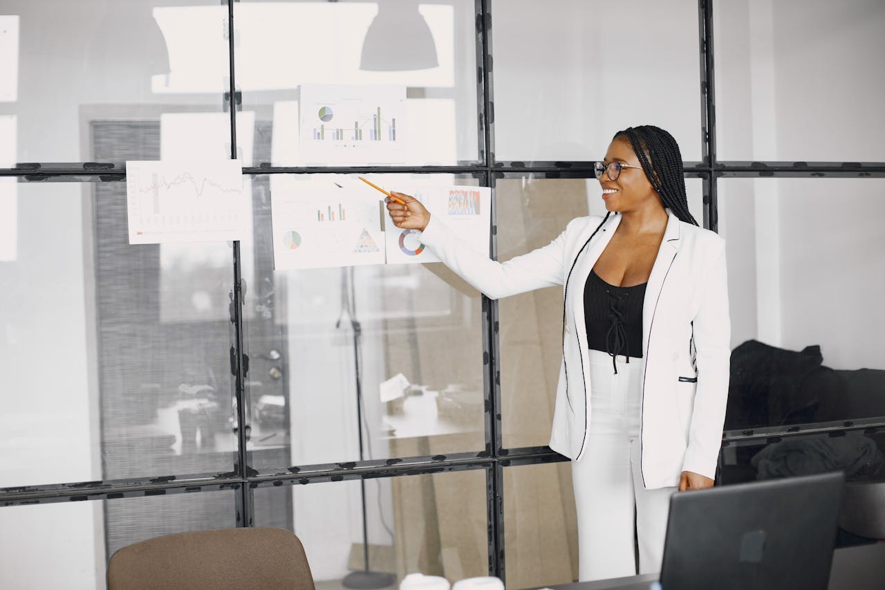 A senior South African manager presenting performance data to colleagues.
